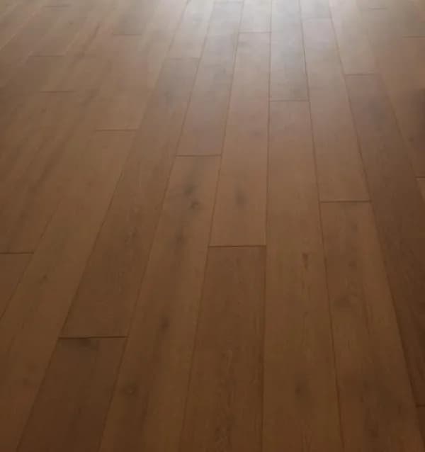 Brown wood-look planks seen at an angle, with a soft sheen