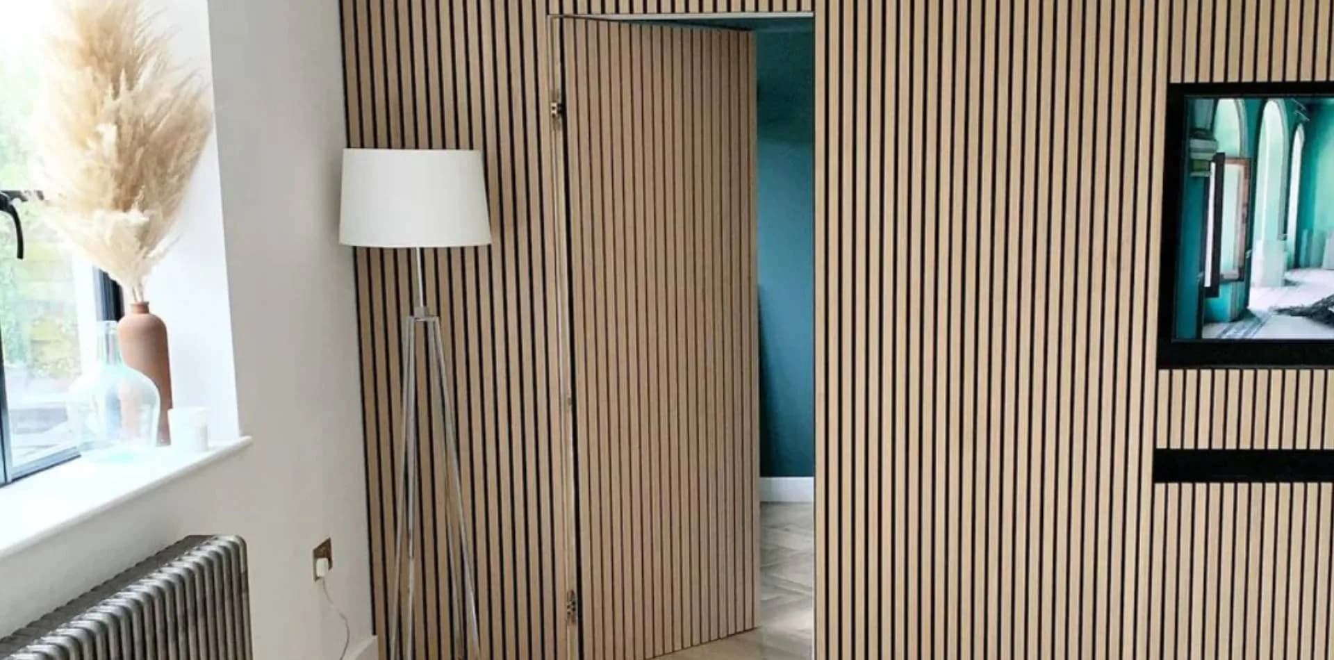Fluted timber wall panelling with a matching hinged door