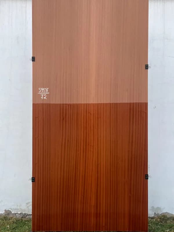 Sapeli wood veneer sheet, shown half raw and half finished