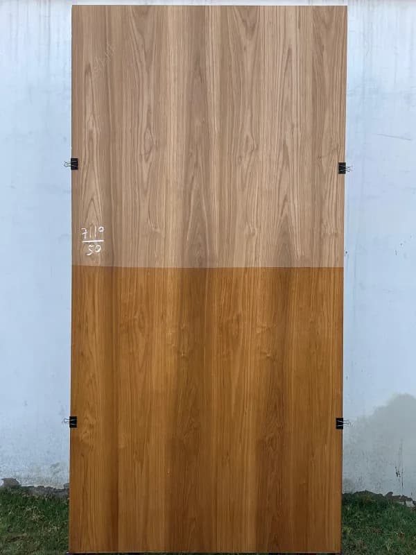 Teak wood veneer sheet, shown half raw and half finished