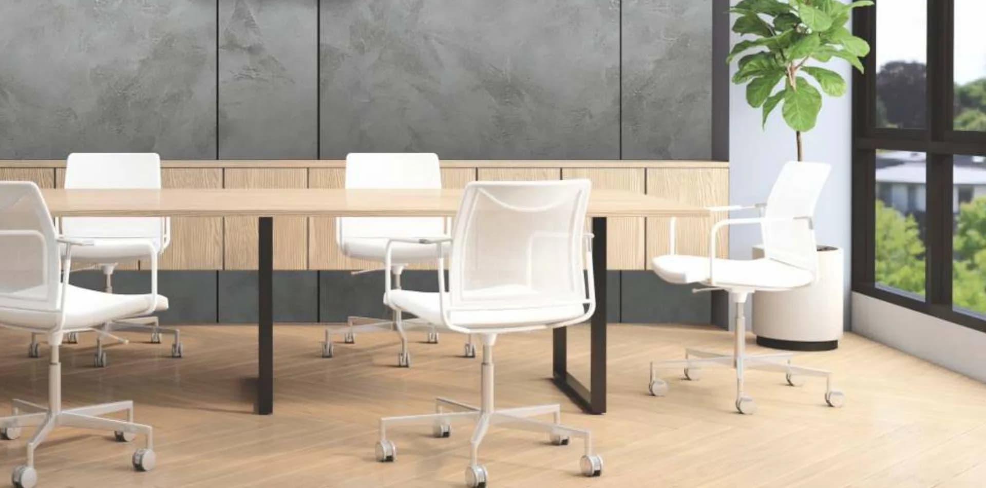 Light wood floor in a meeting room with a long table and white chairs