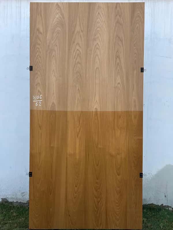 Fourth teak veneer sheet, raw above and finished honey-brown below