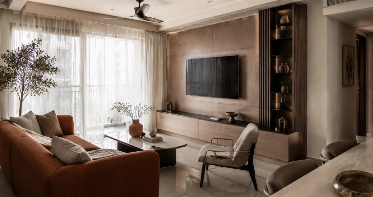 Modern Indian living room with durable laminate TV wall panelling, engineered stone coffee table and vitrified tile flooring