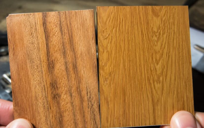 Macro comparison of a real wood veneer swatch with natural grain pores beside a printed wood-pattern laminate swatch