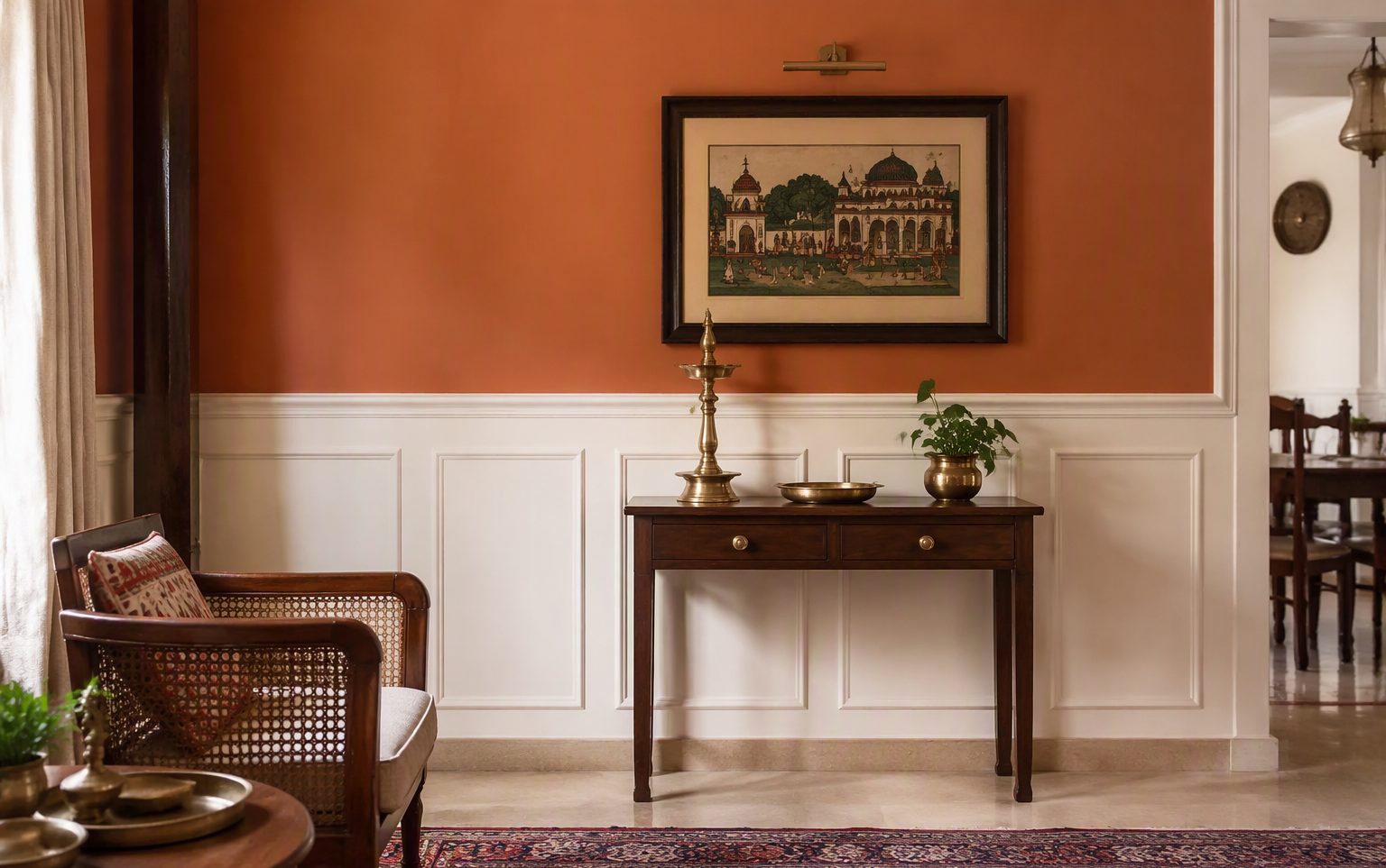 Living room with white wainscoting on the lower wall and warm painted wall above the chair rail