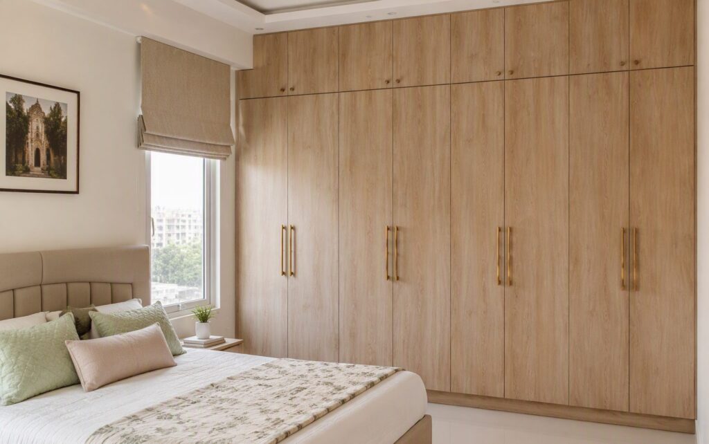 Indian bedroom with floor-to-ceiling plywood wardrobe in laminate finish